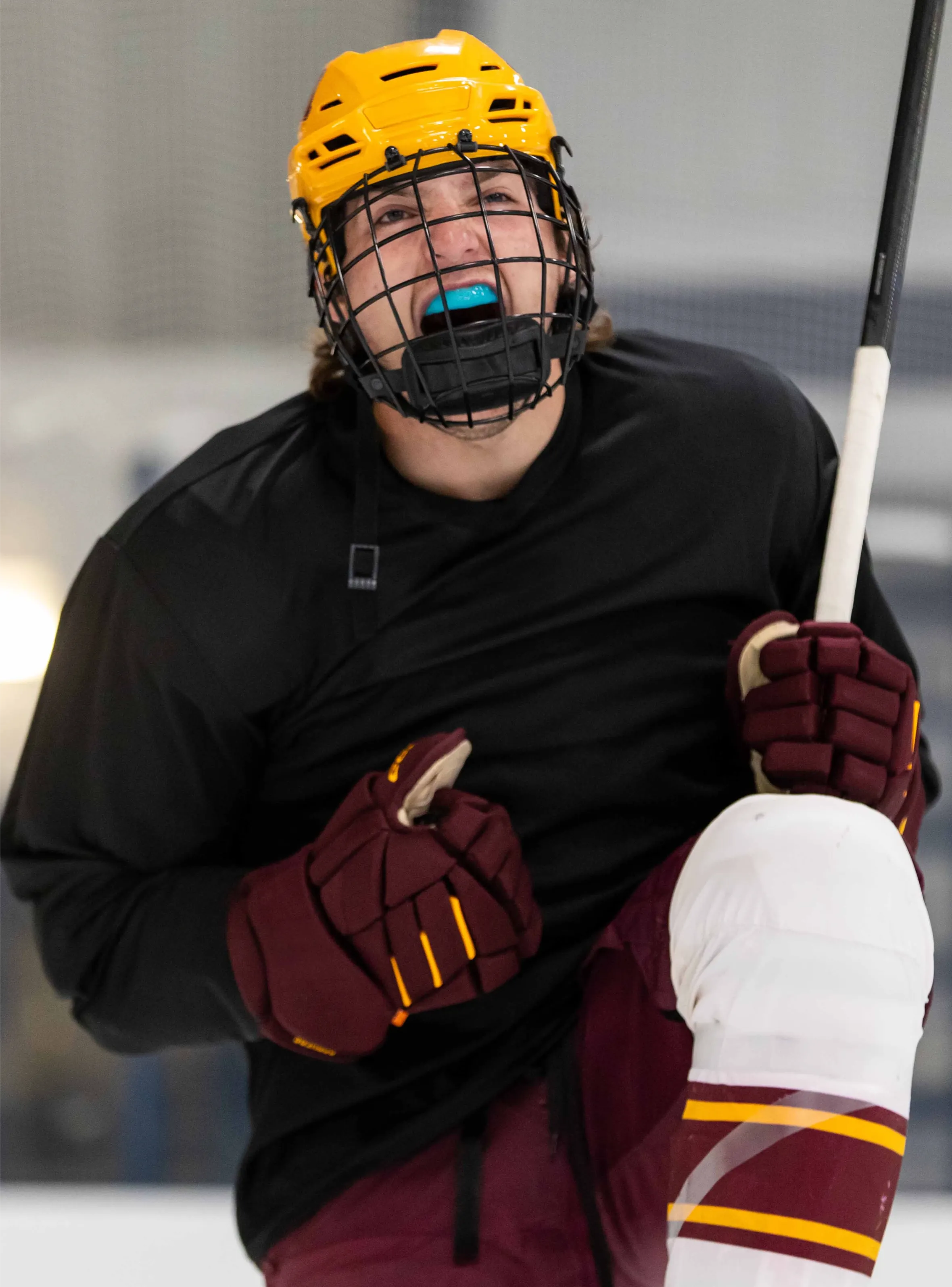 Hockey player wearing a custom fit mouthguard.